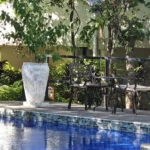 Swimming pool and gardens at Kasambabezi Lodge in Victoria Falls, Zimbabwe